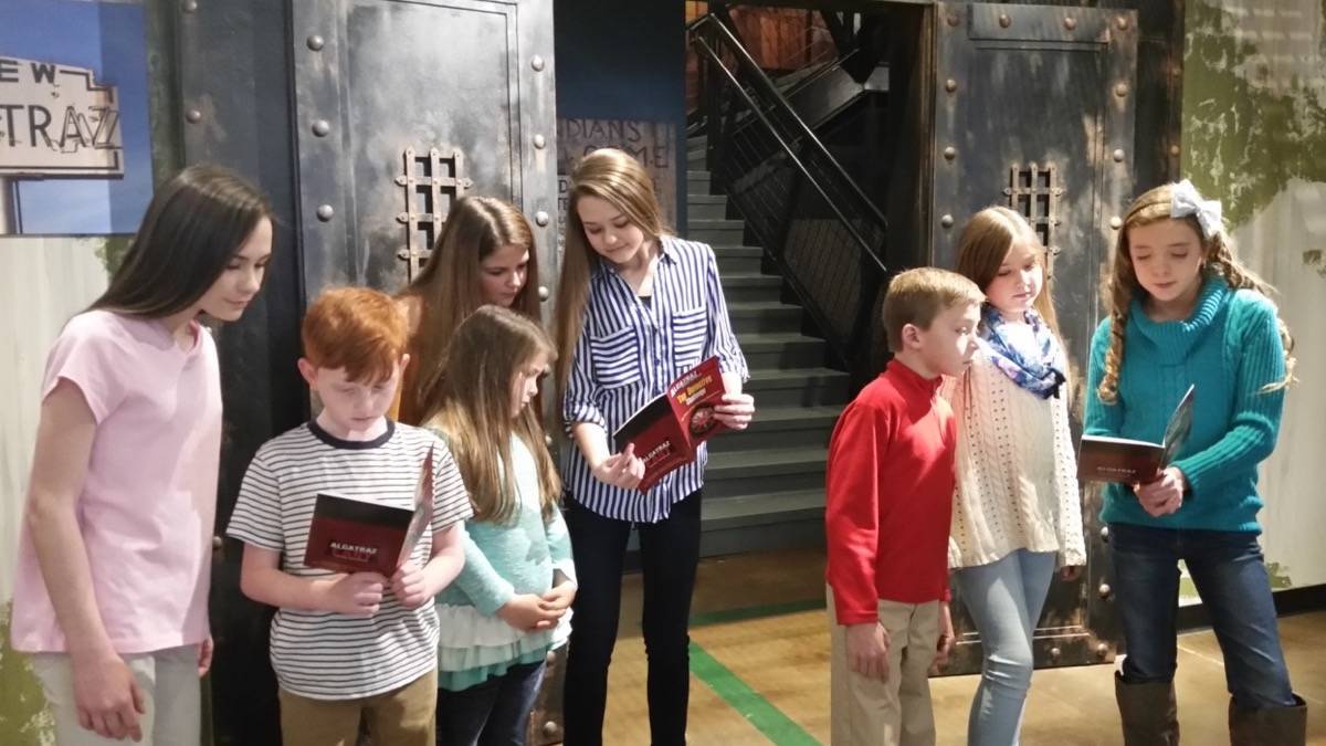 Children looking at books at the East Alcatraz Crime Museum